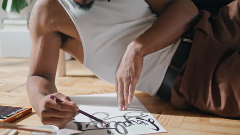 Serious-teenager-drawing-sketch-cozy-place.-Dreadlocks-artist-enjoying-hobby