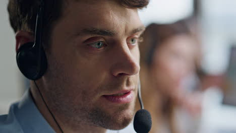 Positive-customer-support-operator-talking-closeup.-Friendly-man-agent-consult