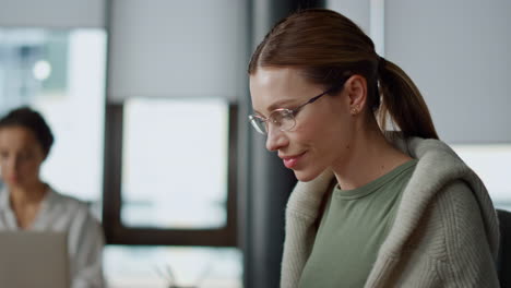 Positive-it-manager-working-computer-closeup.-Inspired-woman-journalist-typing