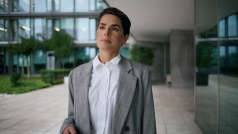 Successful-businesswoman-walk-downtown-in-suit.-Middle-aged-woman-leaving-office