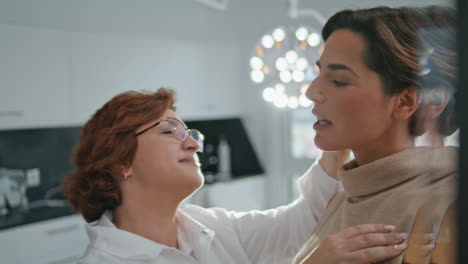 Woman-satisfied-facial-rejuvenation-looking-on-mirror-cosmetology-clinic-closeup