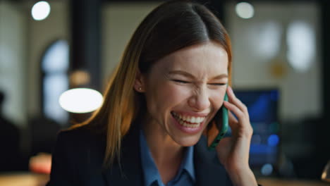 Joyful-manager-speaking-mobile-phone-closeup.-Happy-businesswoman-enjoy-victory