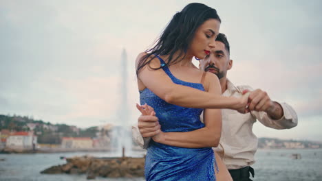 Hispanic-dancers-performing-sensual-dance-with-passion-at-cloudy-sky-close-up.