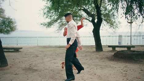 Two-dancers-performing-latino-dance-in-city-park.-Artists-moving-dancing-samba