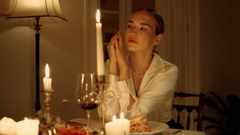 Sad-lady-bored-alone-at-candles-table-place-closeup.-Upset-girl-waiting-somebody