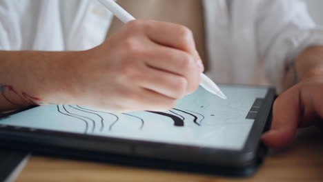 Woman-fingers-working-interactive-pen-at-home-close-up.-Unknown-creator-drawing