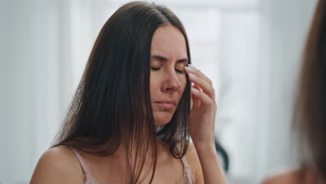 Stressed-girl-holding-pregnancy-test-mirror-place.-Woman-sad-of-unplanned-baby