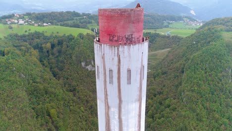 A-close-up-shot-of-graffiti-at-the-top-of-a-chimney