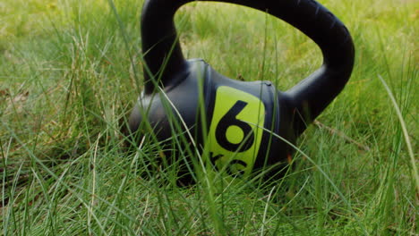 close-up-the-kettlebell-on-the-green-grass-in-nature