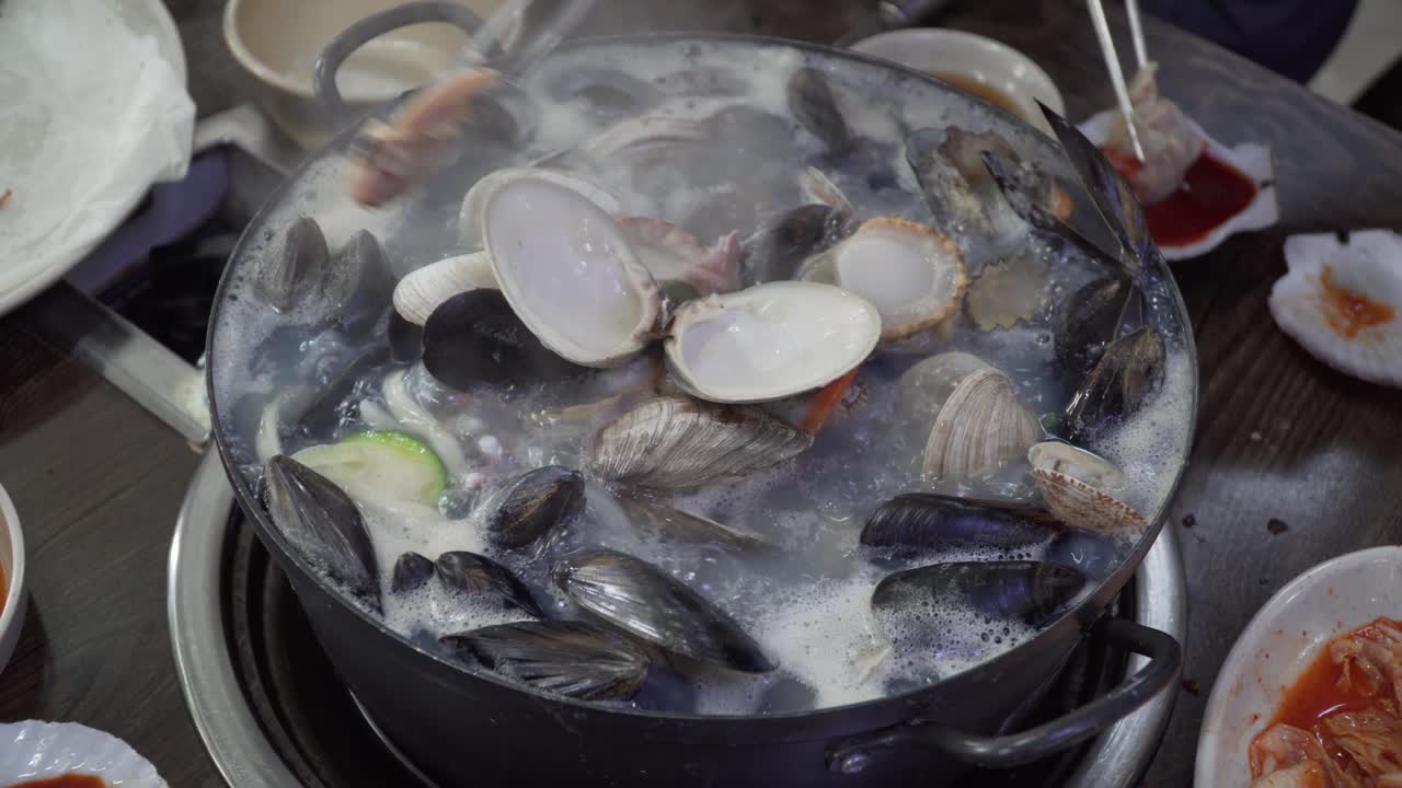 Delicious Seafood Noodle Soup With Shells And Octopus Served In A Hot ...