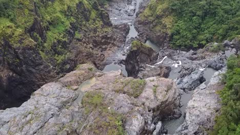 Barron-Falls-Rocky-River-Basin-With-Shallow-Waters-In-Barron-Gorge-National-Park-In-Queensland,-Australia---Drone-Shot