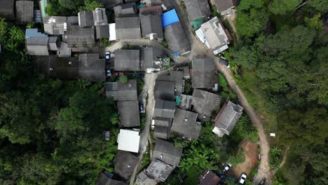 Overhead-drone-flight-looking-down-at-traditional-wooden-houses-in-Thailand-in-slow-motion