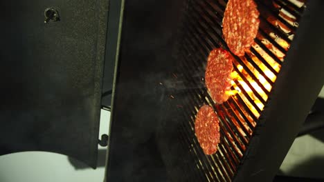 Vertical-Shot-Of-Tasty-Beef-Burger-Meat-Cooked-On-Fire-Grill