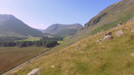 Rock-Covered-Mountain-Slope-Meadow,-Low-Aerial-Dolly-in,-Scotland