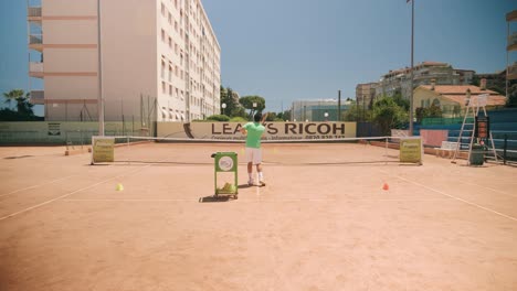 Tennis-match-lesson-between-man-and-girl,-dolly-in-slow-motion