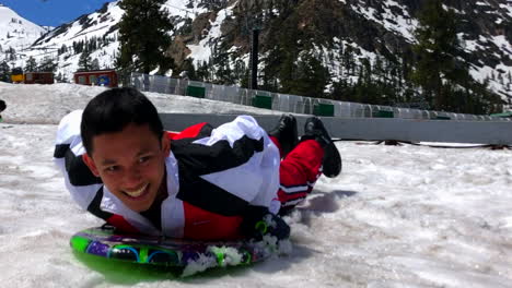 Boys-sliding-down-on-the-snow-at-Squaw-valley