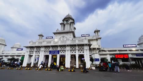 A-static-shot-of-Kacheguda-railway-station-where-few-cars-are-seen-running-on-the-outside-road-at-sunset-time