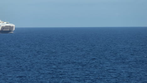 Fast-Ferry-of-the-Balearia-in-the-middle-of-the-sea-arriving-near-Ciutadella-in-Menorca-during-summer-2021