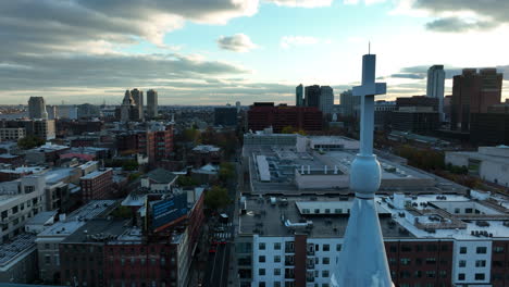 Orbit-of-cross-atop-steeple-reveals-Philadelphia-skyline-at-beautiful-sunset