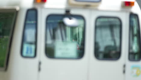 traffic-car-and-bus-with-pedestrian-waiting-at-the-station-wearing-protective-mask