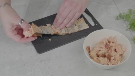 Slow-Motion-Shot-Of-An-Individual-Taking-The-Remaining-Food-Off-Of-The-Skin-And-The-Putting-It-Into-A-Bowl