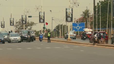 Slowmotion-shot-of-Students-Kids-Crossing-Road-in-African-City---Lomé,-Togo