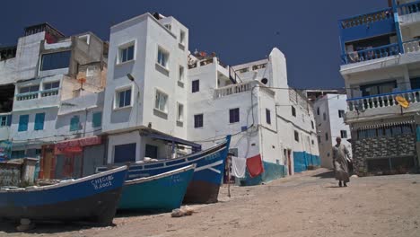 Man-wearing-traditional-clothing-walking-in-Taghazout-village