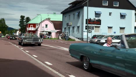 Vintage-Convertible-Cars-Crusing-in-a-Rural-Town-at-Summer,-Slowmo