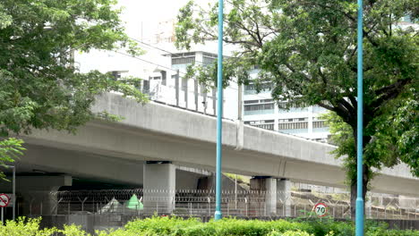 view-train-speeding-along-the-monorail-parallel-to-the-highway