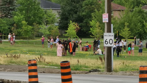 Neighbors-gathered-in-the-meadows-watch-the-rescue-operation,-tragic-accident