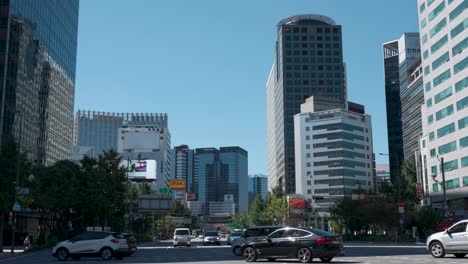 Cars-Driving-To-Sogong-ro-Street-From-Sejong-daero-With-High-rise-Buildings-In-Jongno-gu-in-downtown-Seoul,-South-Korea-From-Seoul-Plaza