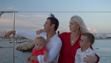 Happy-family-enjoying-their-time-on-a-Catamaran-sail-boat-that-is-arriving-in-the-marina-of-Montpellier,-France