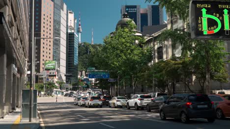 Iconic-N-Seoul-Tower-building-view-from-downtown-city-street-and-cars-busy-traffic-near-Bank-of-Korea-Money-Museum