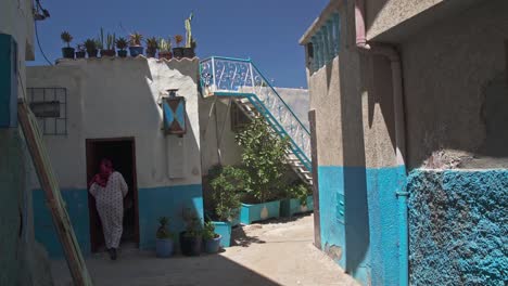 Woman-walking-in-an-narrow-alley-in-Taghazout