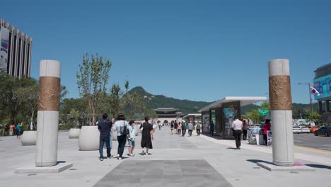 Korean-people-visit-Gwanghwamun-Square-on-a-summer-day,-Seoul-city-life---wide