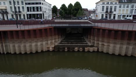 Forward-aerial-movement-showing-the-quay-under-construction-at-river-IJssel-with-work-in-progress-on-the-IJsselkade-boulevard-of-tower-town-Zutphen-urban-development