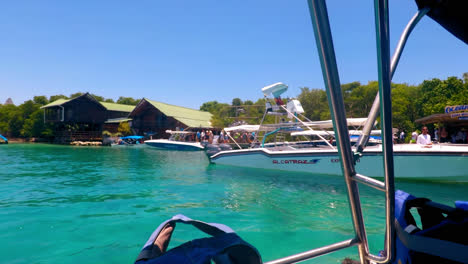 General-shot-of-a-Speedboat-in-the-ocean-arriving-at-the-crowded-Ocenarium-Dock-in-Cartagena-Colombia-in-a-sunny-day