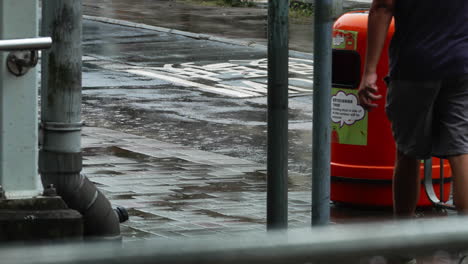 China,-Hong-Kong--August-11,-2022:-people-walking-through-the-rain,-half-body-focused