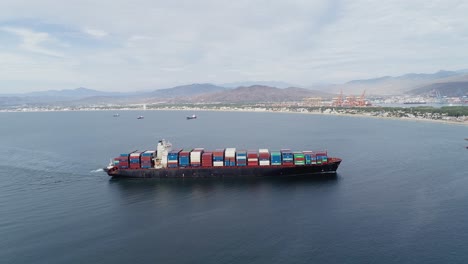 Aerial-view-of-a-mega-ULCV-tanker,-arriving-at-a-seaport-in-Manzanillo,-Mexico