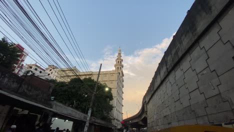 Looking-Up-At-Electrical-Wires-And-Pan-Down-To-Busy-Gridlocked-Road-With-Rickshaws