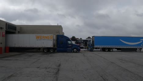 Driving-slowly-POV-in-a-truckstop-