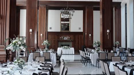 White-and-black-tables-set-out-for-a-wedding-reception