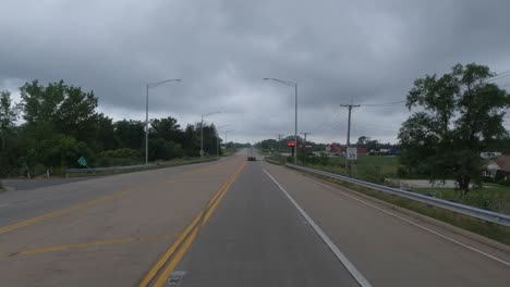 POV:-Trucker-driving-truck-through-a-green-light-on-an-empty-road