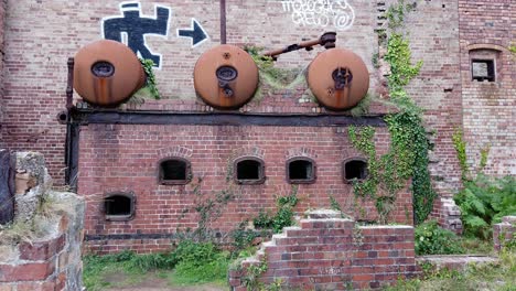 Abandoned-rusty-graffiti-covered-Porth-Wen-brickwork-furnace-ruins-in-rural-Anglesey-walk-through