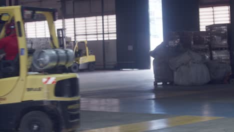 Employee-at-the-coffee-bean-factory-using-a-forklift