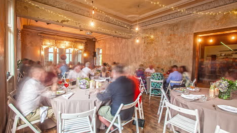 Static-timelapse-of-people-at-celebration-event-in-elegant-dining-hall