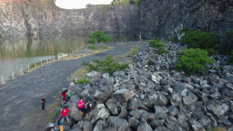 Overtake-Shot-Of-Tourists-Exploring-Majestic-Place-In-Nature,-Exploited-Hill-More-Than-30-Years,-Paraguay