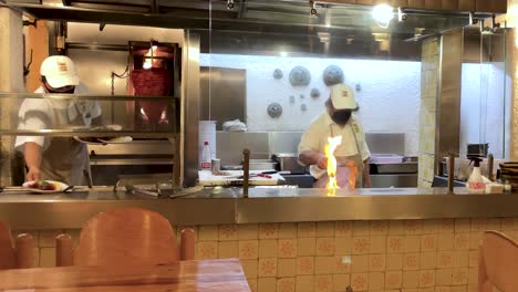 slow-motion-shot-of-waiter-serving-plates-of-tacos-in-mexico-city