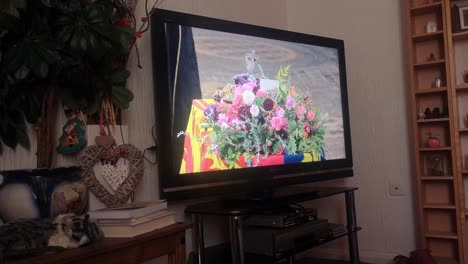 Household-watching-Her-Majesty-Queen-Elizabeth-funeral-service-broadcast-on-British-television-at-home