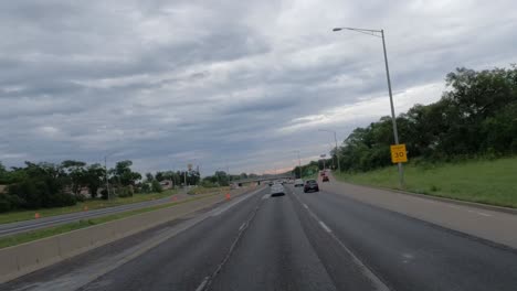 POV:-Trucker-sees-another-car-drive-past-the-one-on-the-right-lane-in-Chicago